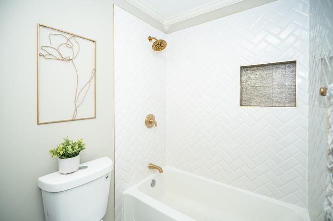 Rutland after photo: Tub & shower with gold fixtures