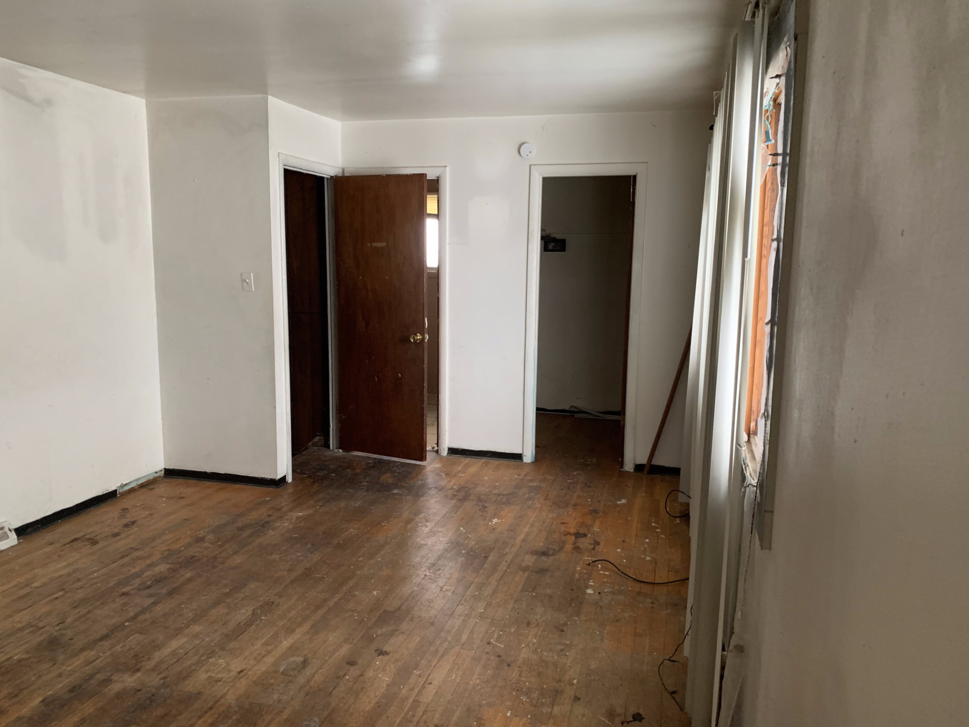 Wood before photo: Original bedroom looking toward the doorways