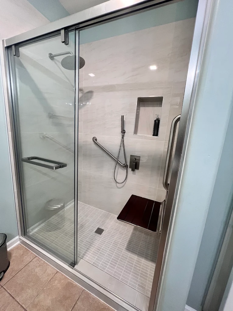 Accessible Walk-In Shower after photo: Accessible walk-in shower with fold-down seat