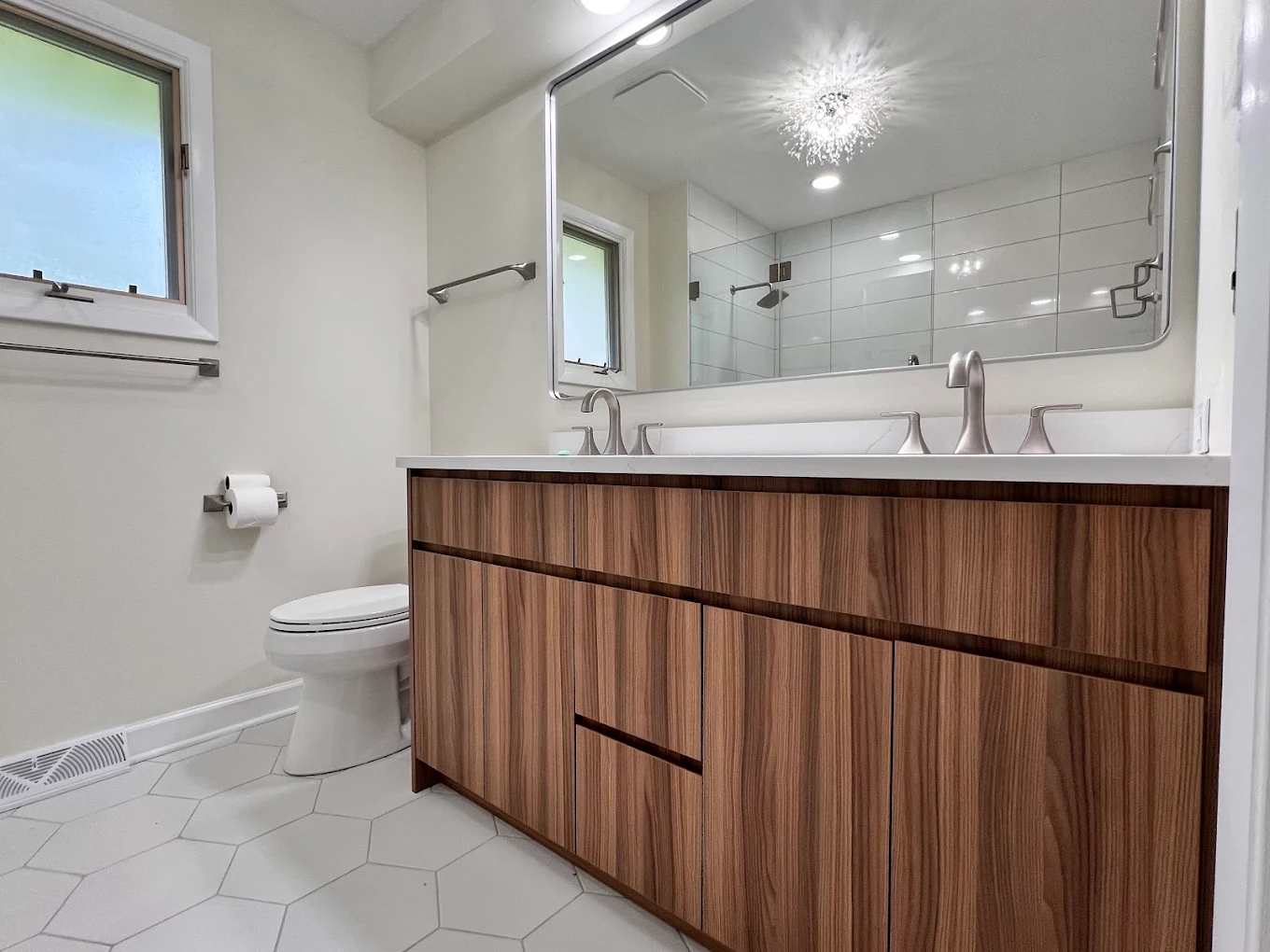 Jetted Tub & Walnut Vanity after photo: Walnut double vanity on large hexagon floor tile
