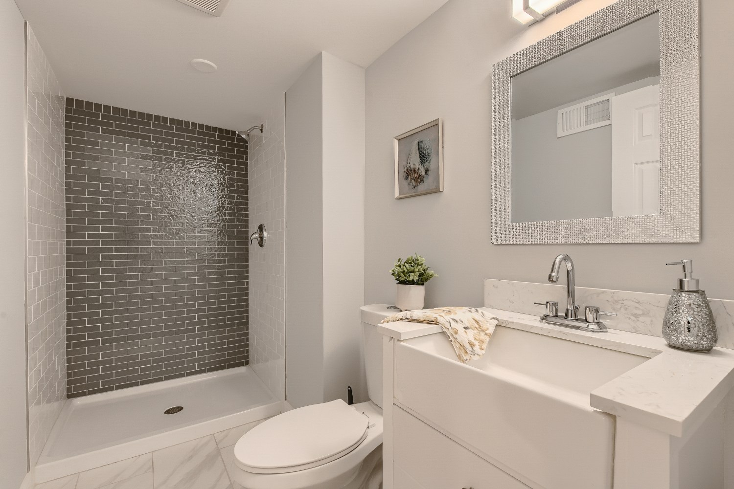 Sawyer after photo: Lower-level full bath with walk-in shower