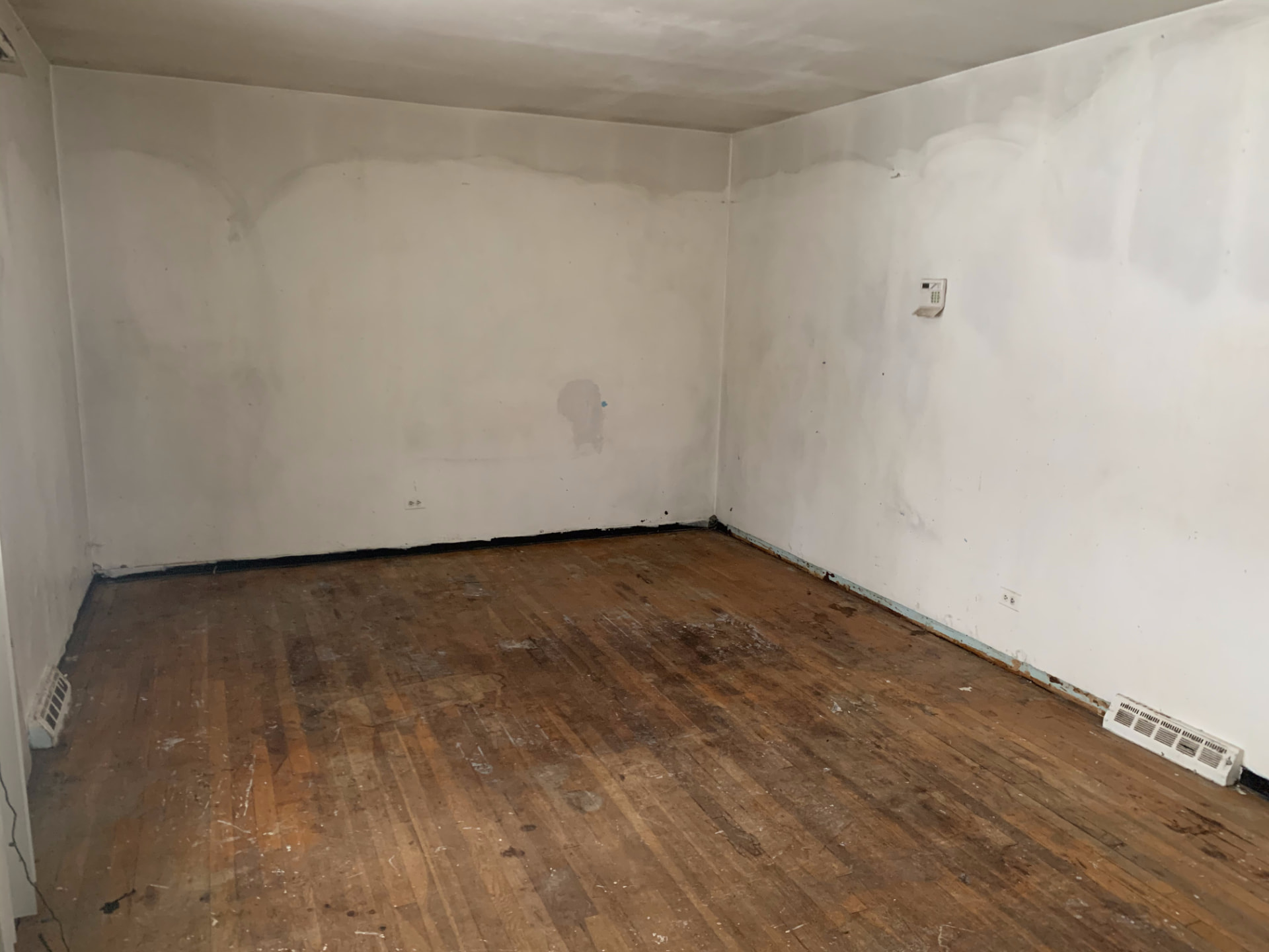 Wood before photo: Original bedroom walls and flooring