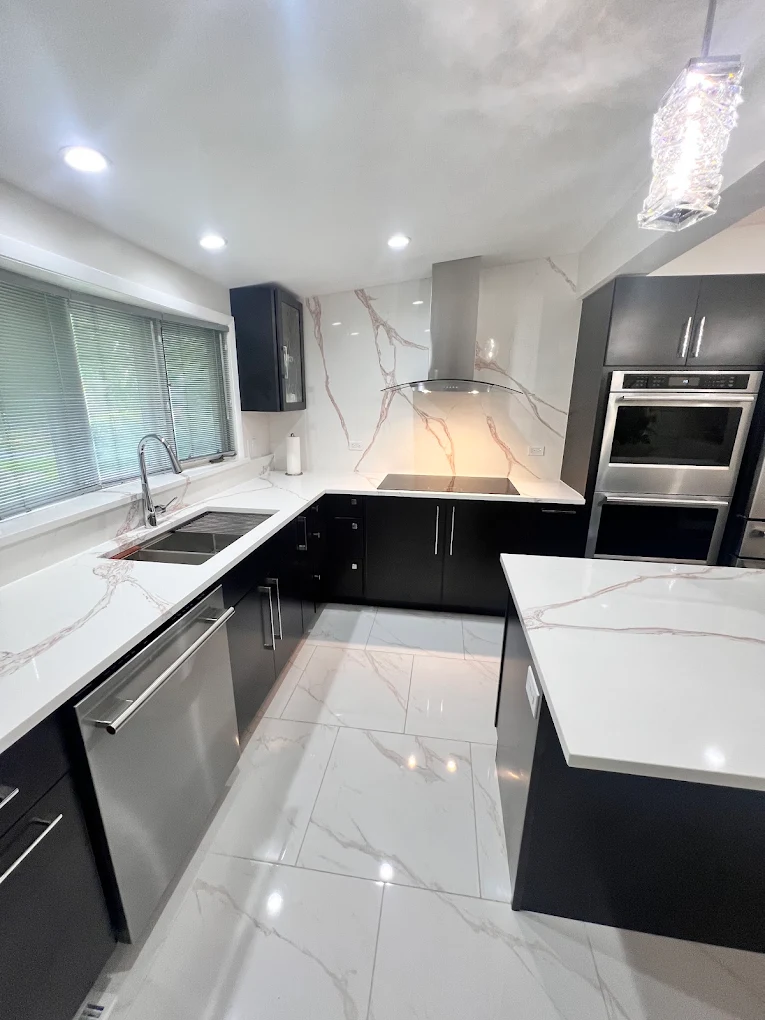 Dark Cabinetry & Marble-Look Kitchen after photo: Full kitchen with marble-look tile flooring