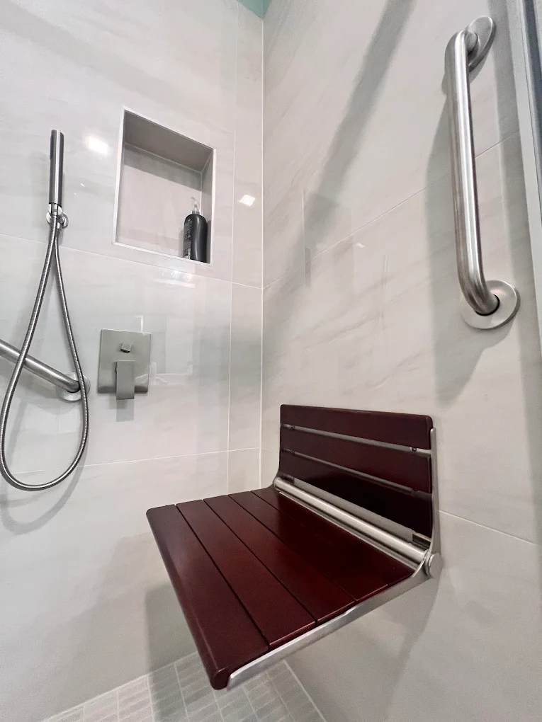 Accessible Walk-In Shower after photo: Shower seat with vertical grab bar