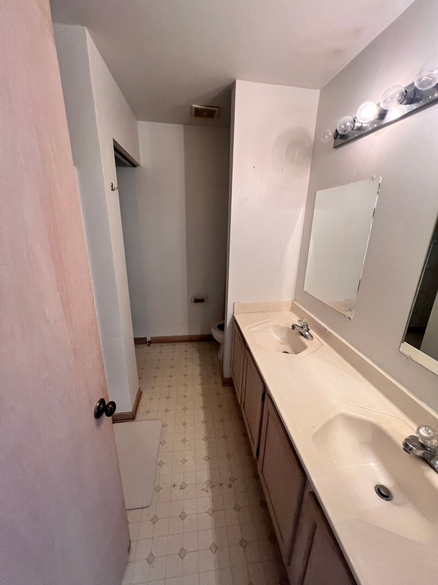 Charlotte before photo: Primary bath double vanity