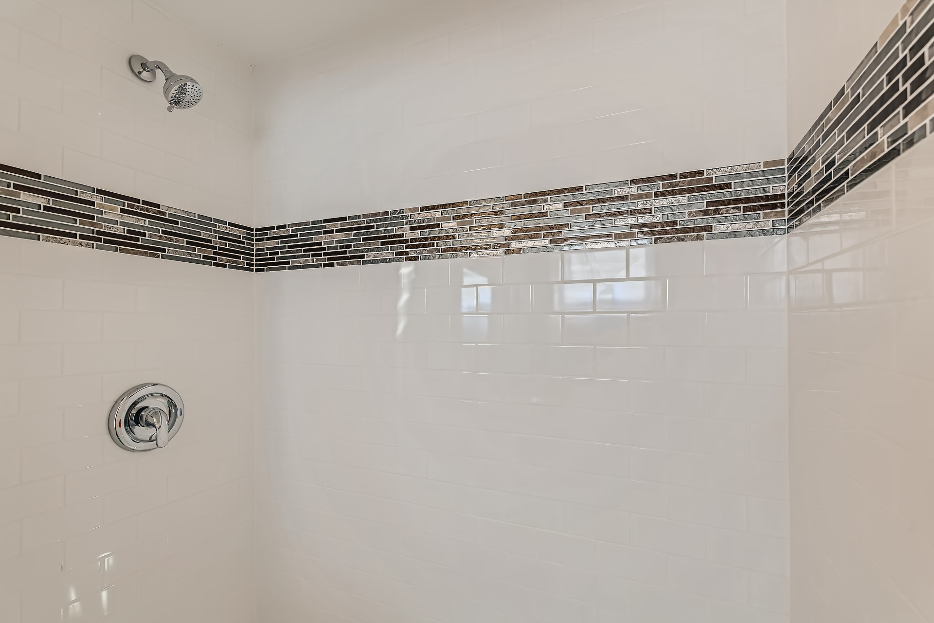 Racine after photo: Tiled shower with mosaic accent band