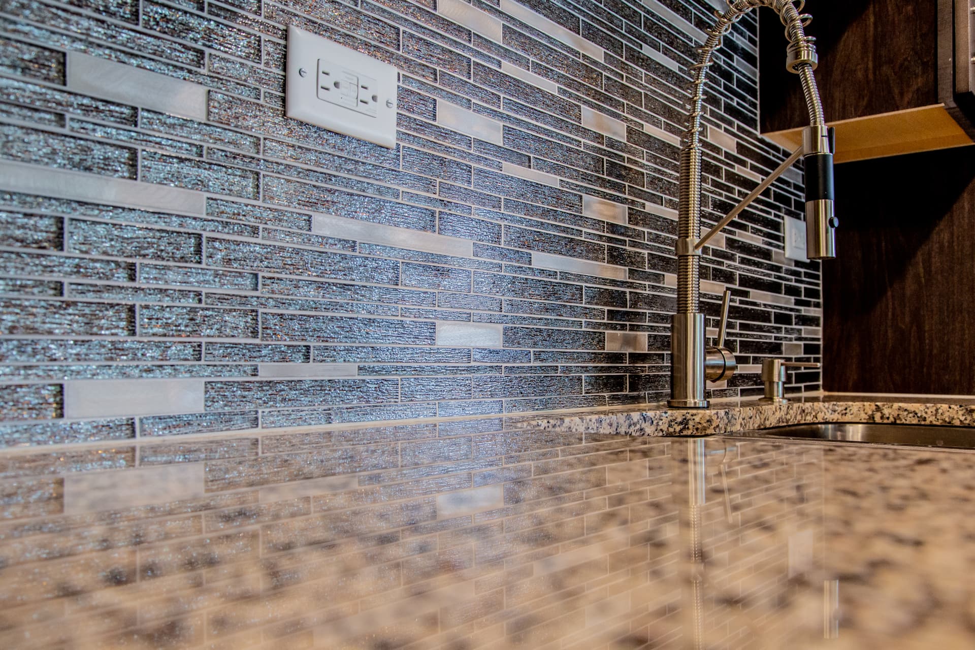 Dark Shaker Kitchen & Granite Counters after photo: Mosaic backsplash and gooseneck faucet detail