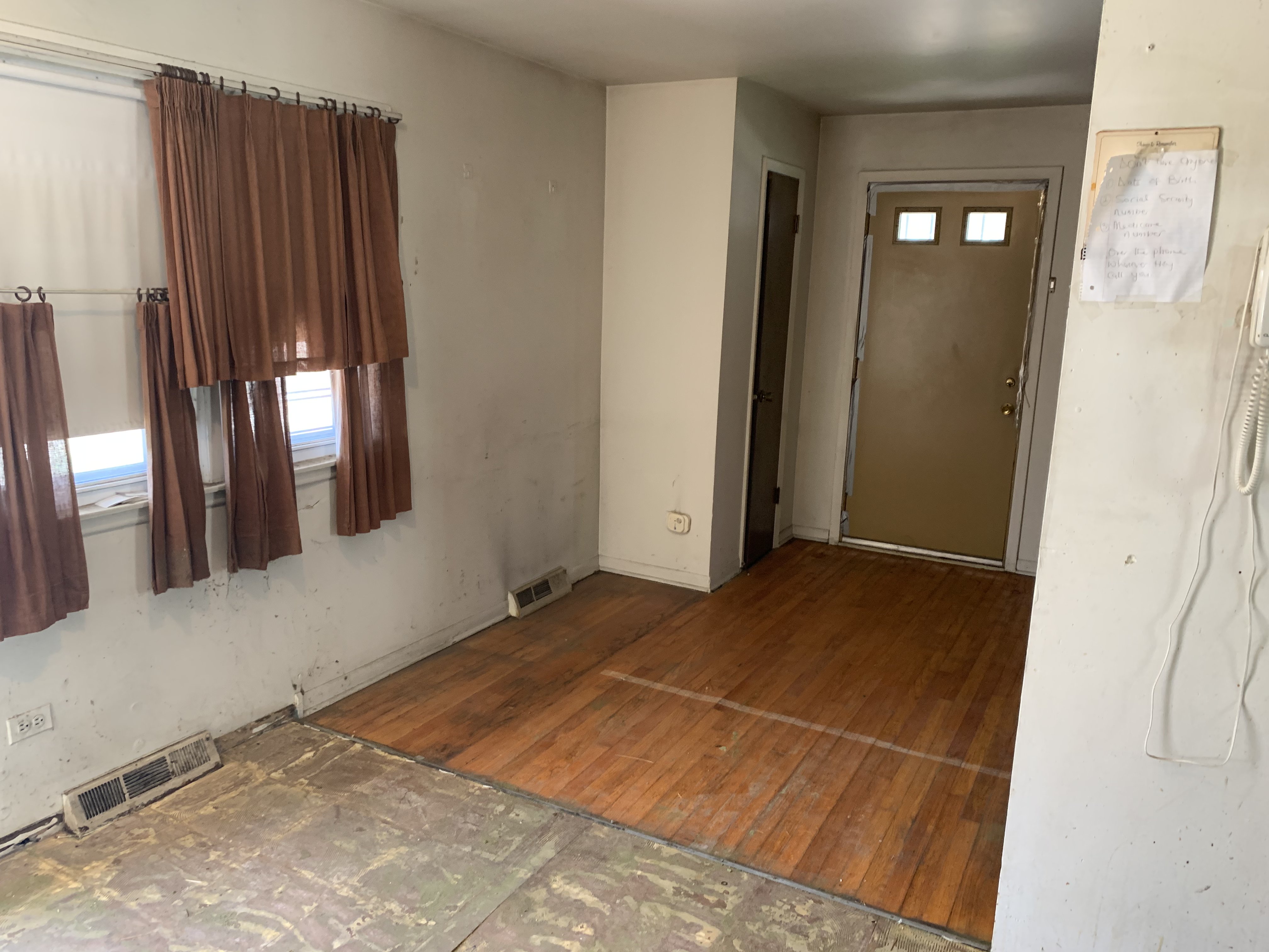 Racine before photo: Dining area looking toward the front door
