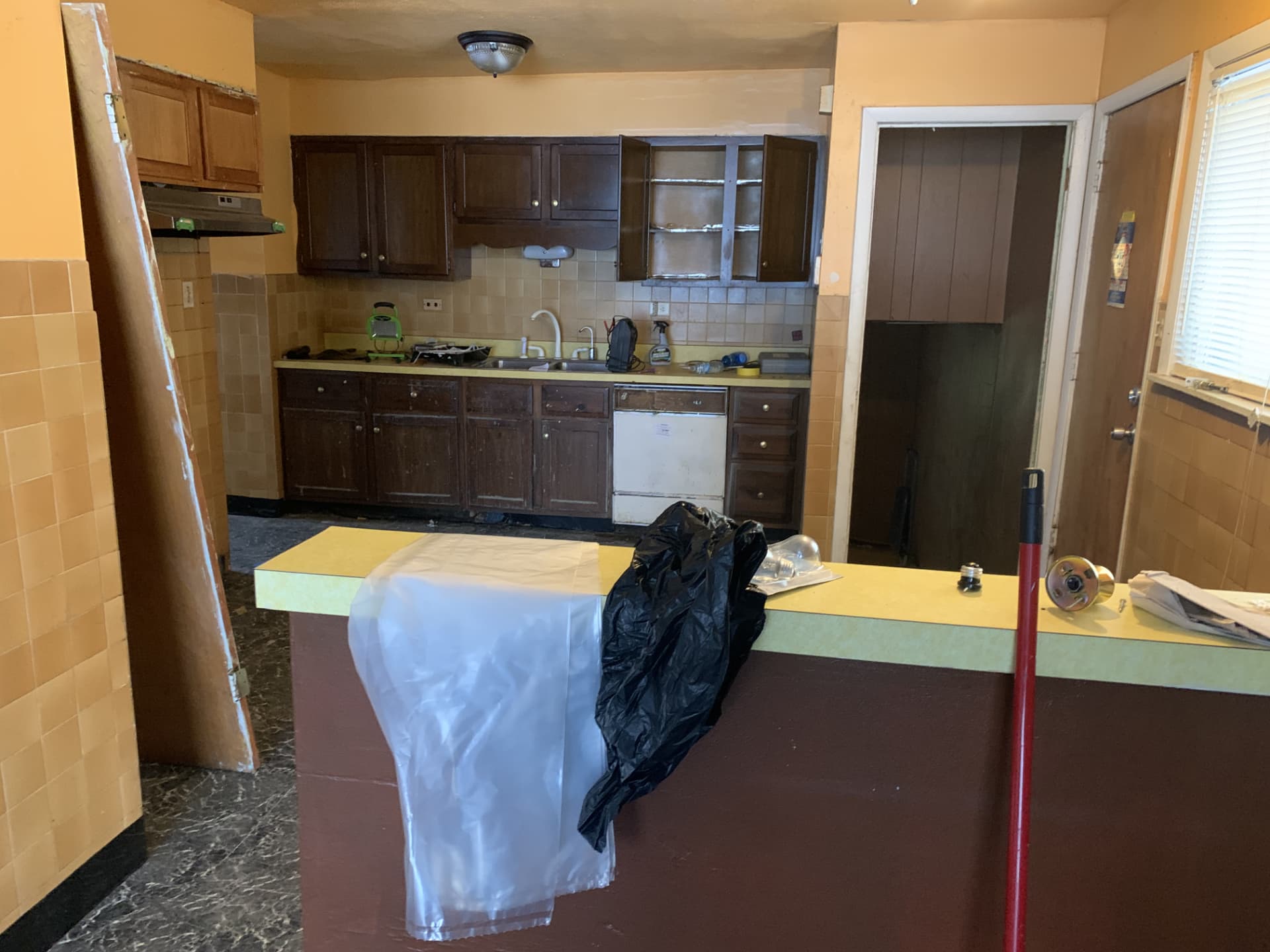 Dark Shaker Kitchen & Granite Counters before photo: Kitchen before the remodel — original cabinets, counters, and tile backsplash