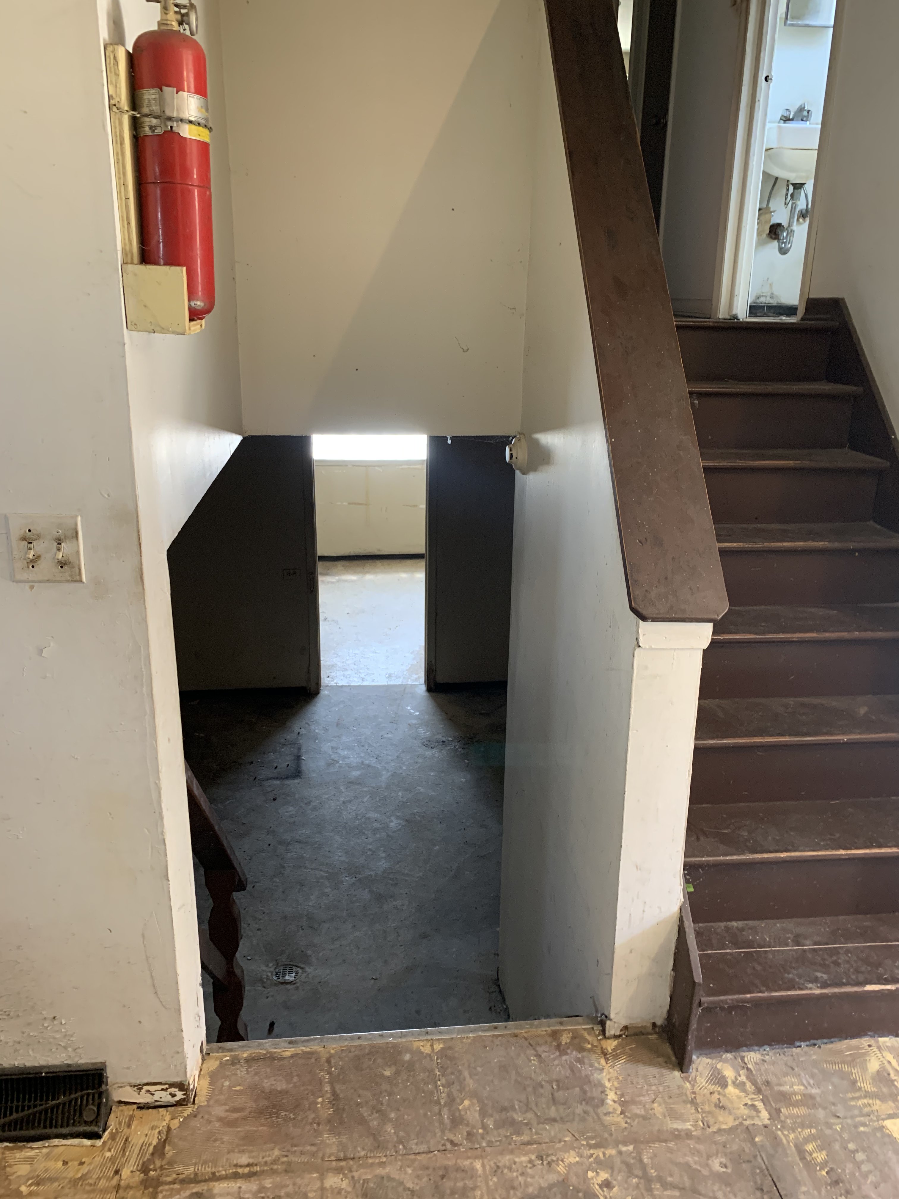 Racine before photo: Original staircase and basement stairs
