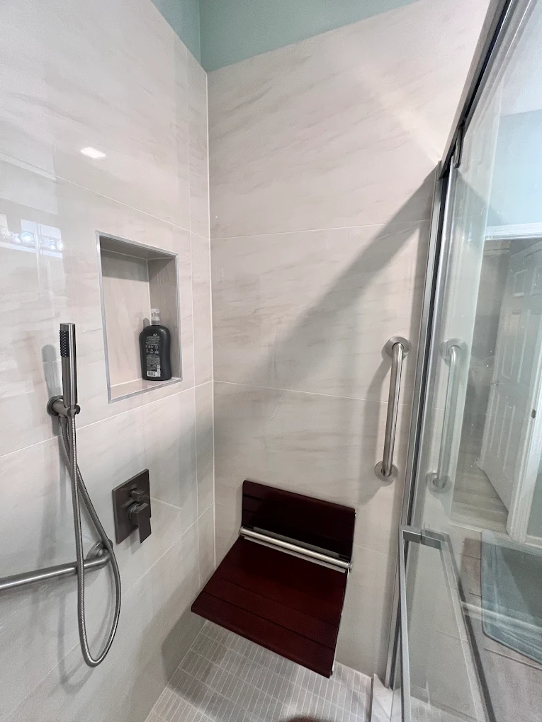 Accessible Walk-In Shower after photo: Niche, hand shower, and seat corner