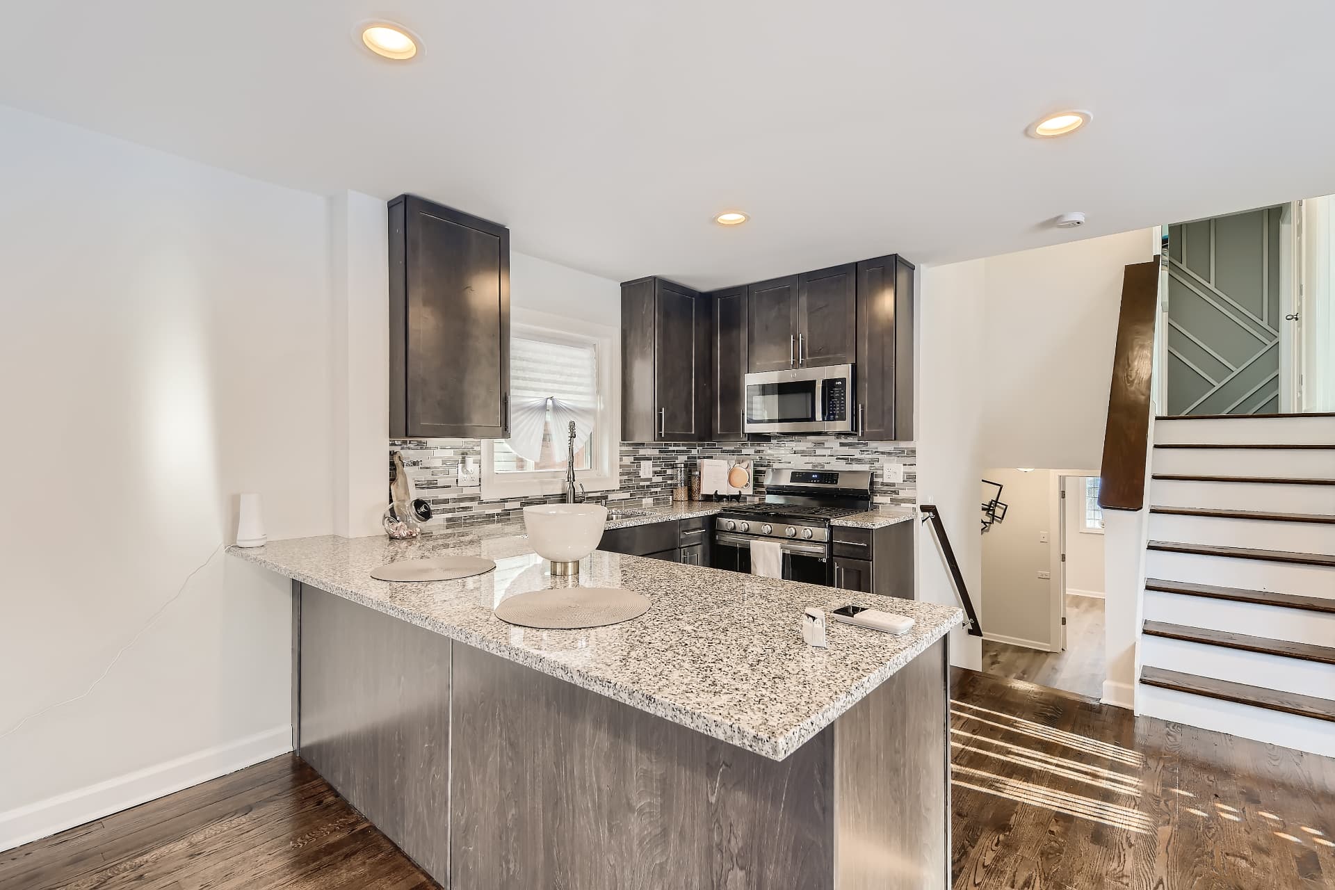 Racine after photo: Kitchen with peninsula and stainless appliances