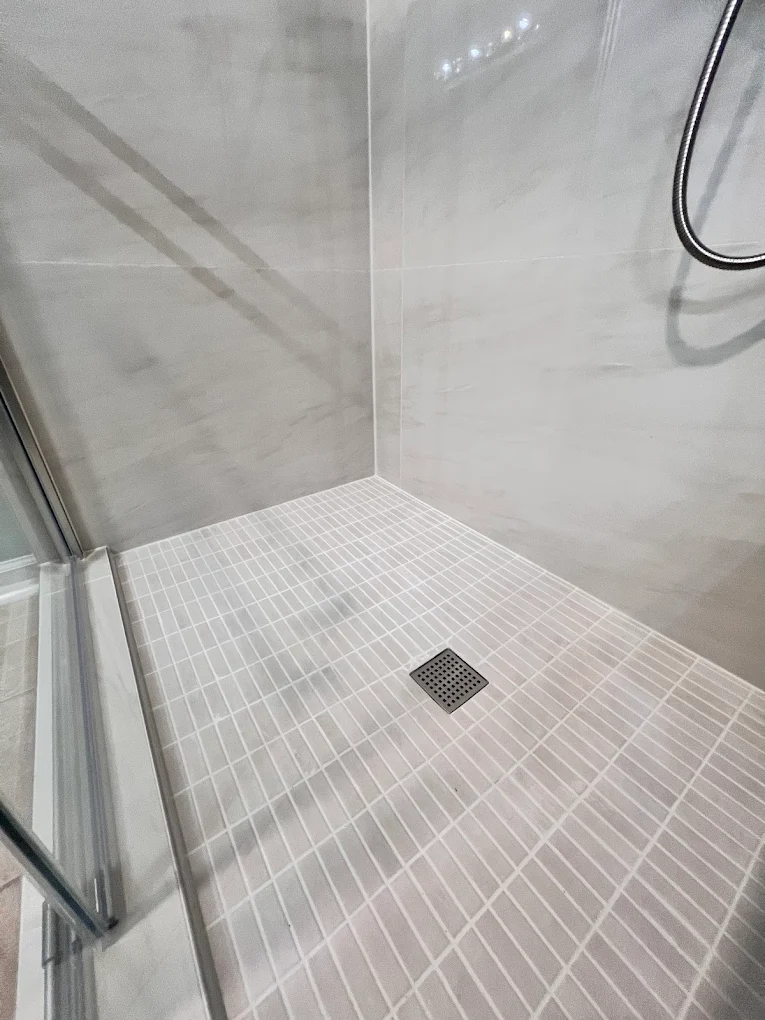 Accessible Walk-In Shower after photo: Mosaic shower floor with square drain