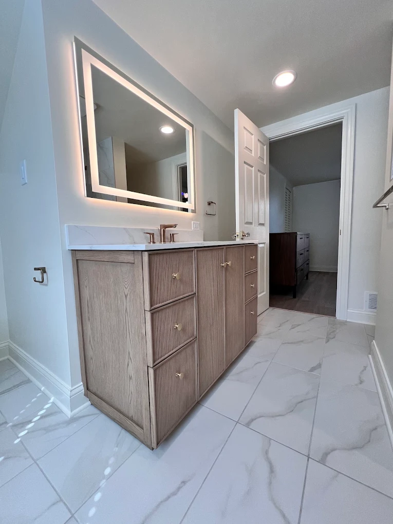 Fluted Oak & Sage Green after photo: Fluted oak vanity with backlit mirror