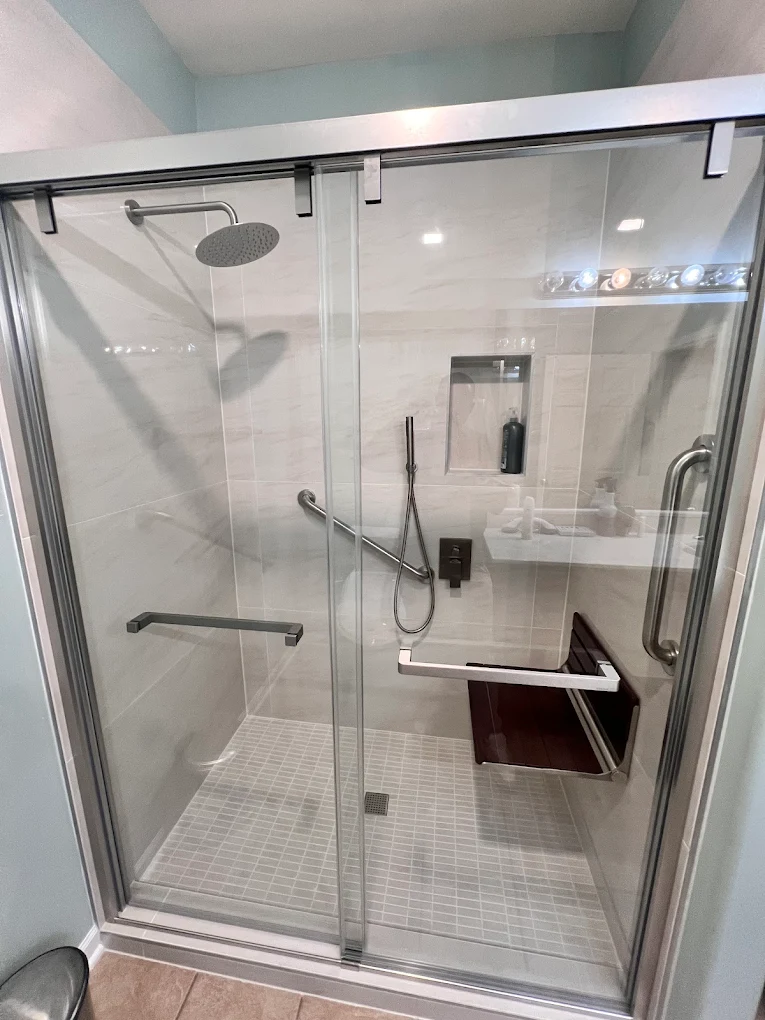 Accessible Walk-In Shower after photo: Walk-in shower with sliding glass doors