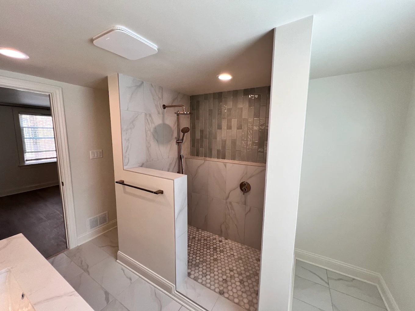 Fluted Oak & Sage Green after photo: Doorless shower with sage green accent tile